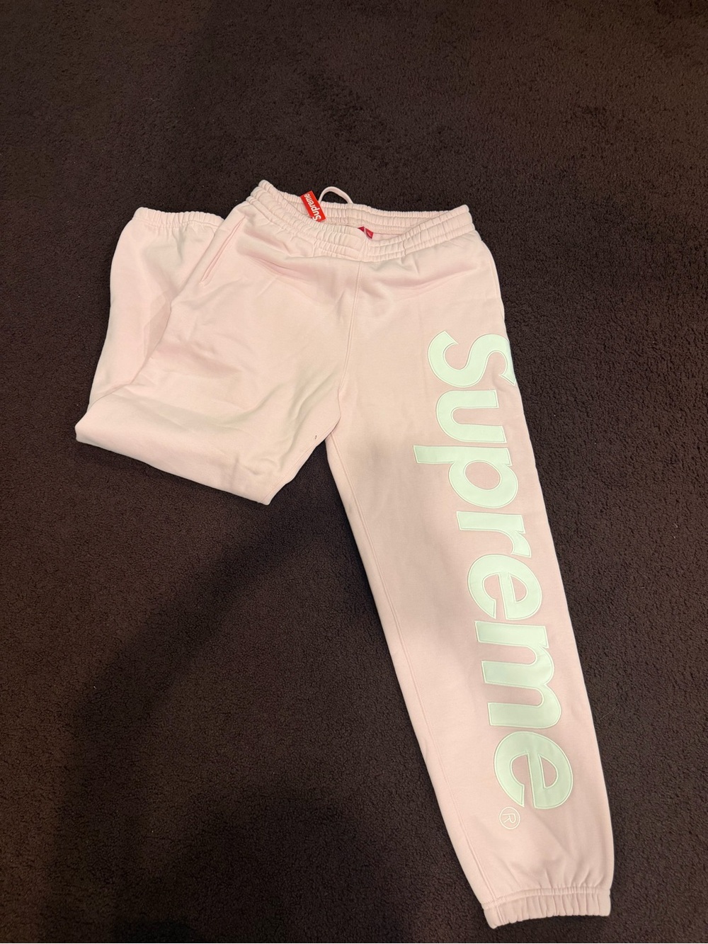 Supreme men’s size small can fit women to Pink Logo Sweatpants